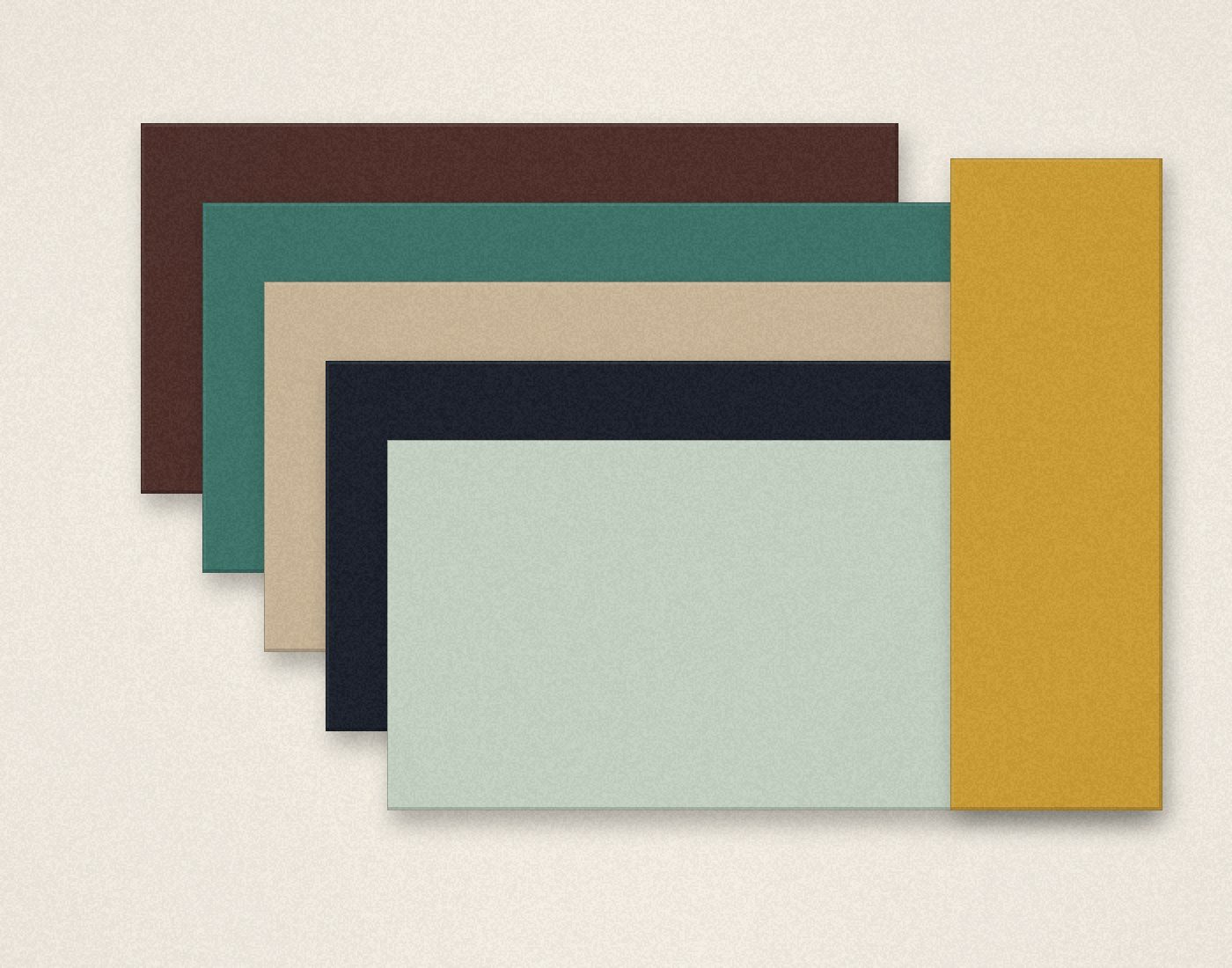 Stacked licence slabs in walnut, jade and sandstone with an ochre edge.